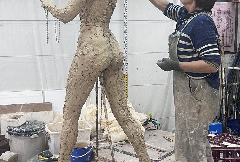 Early stage, clay figure sculpting