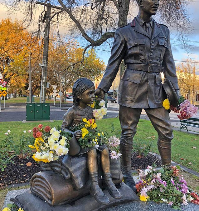 George D Treloar sculpture, with flowers