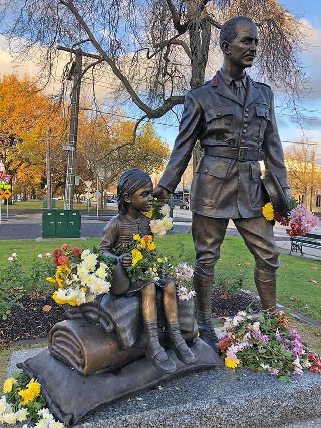George D Treloar sculpture, with flowers